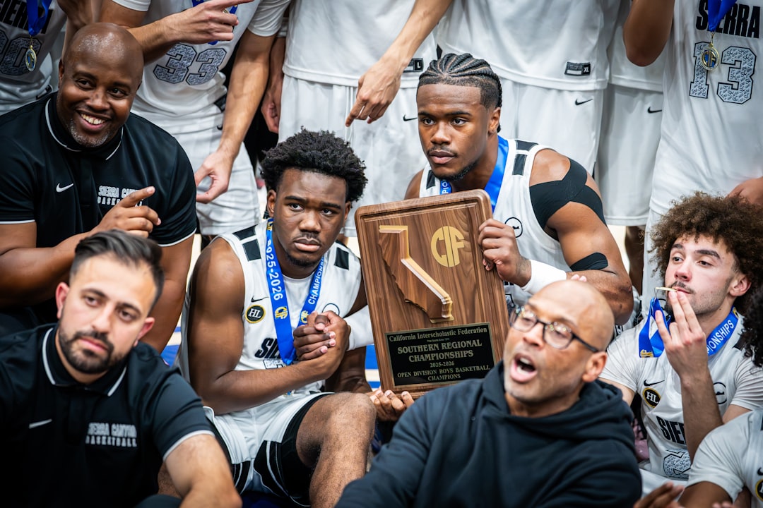 Basketball team celebrates championship win with trophy