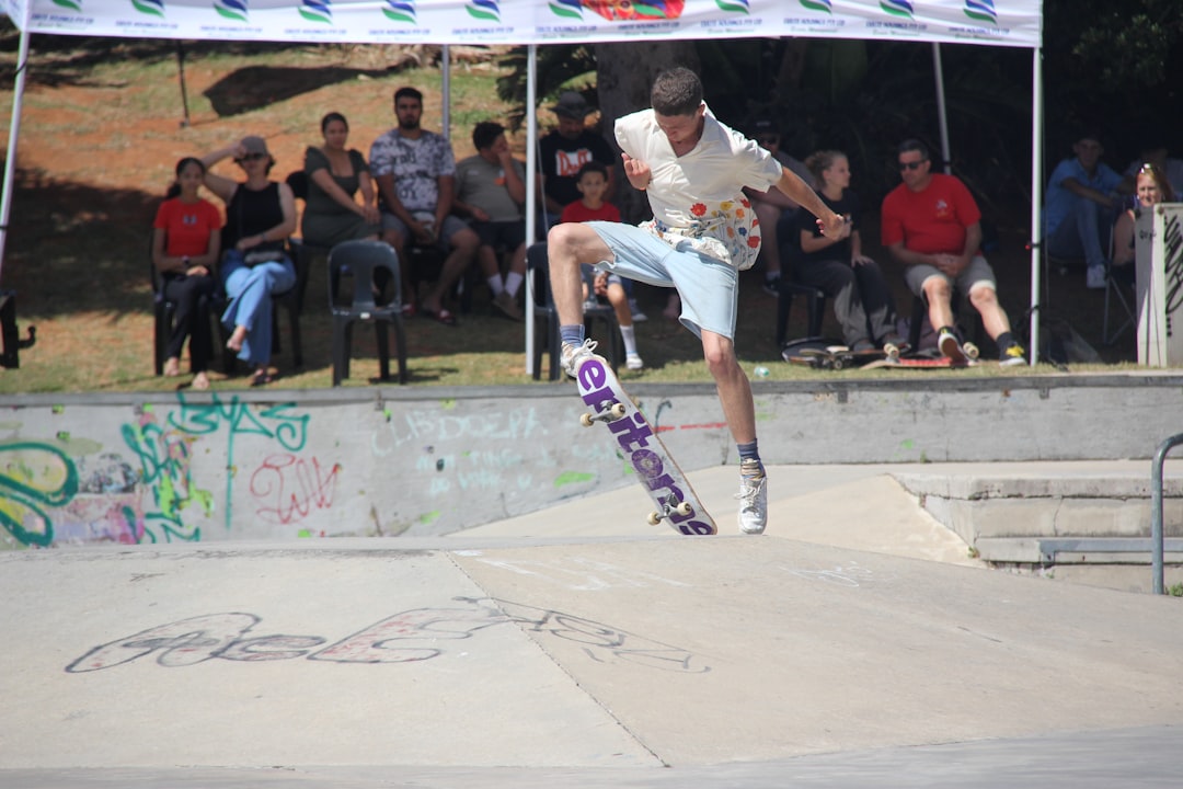 Young man performing a trick on a skateboard