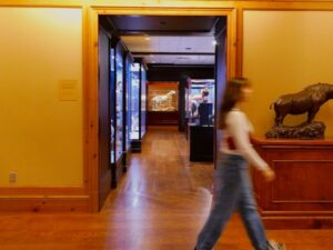 Person walking through a museum exhibit hall