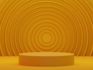 a round yellow object in front of a yellow background