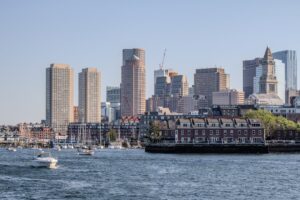 a large body of water with a city in the background