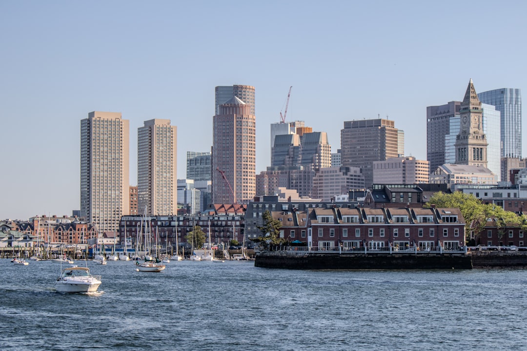 a large body of water with a city in the background