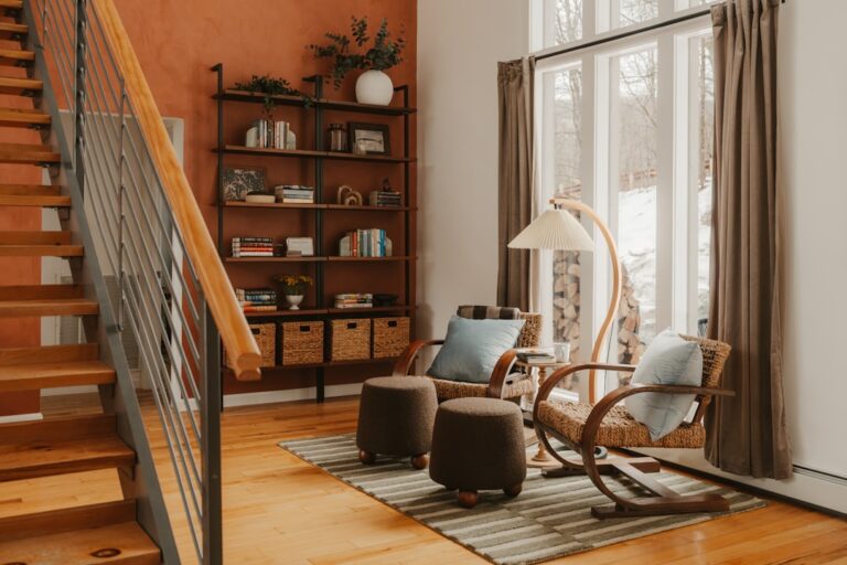 Cozy living room with rocking chairs and bookshelf.