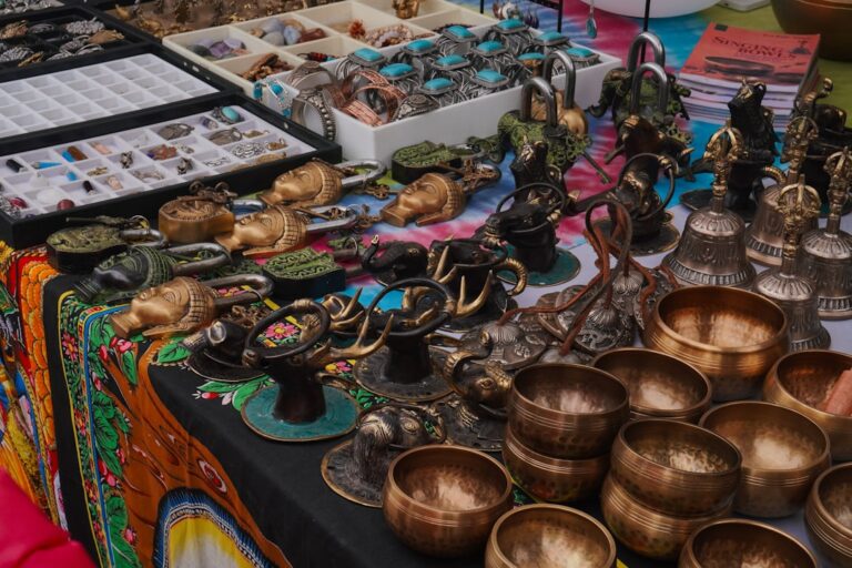 a table topped with lots of metal cups and bowls