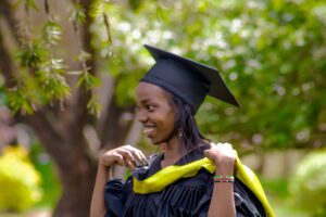 a woman in a graduation cap and gown