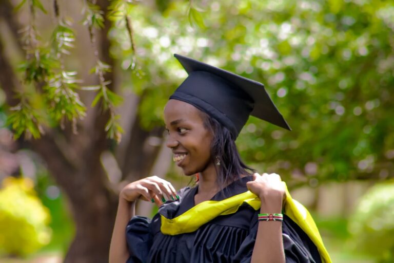 a woman in a graduation cap and gown