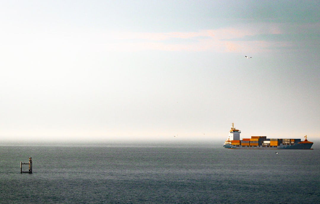 Cargo ship sailing on the calm ocean.