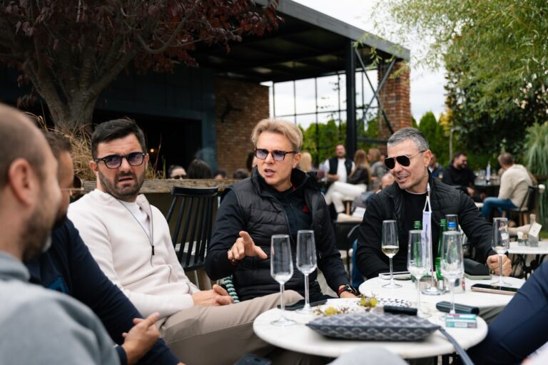 Group of people sitting at an outdoor cafe