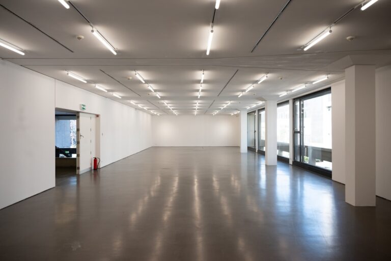 Empty modern exhibition hall with fluorescent lights