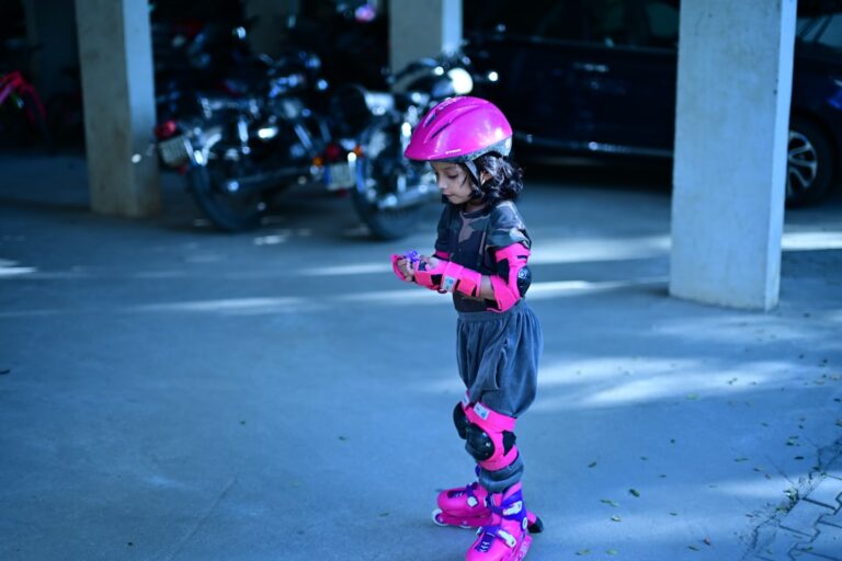Young child in rollerblades and protective gear