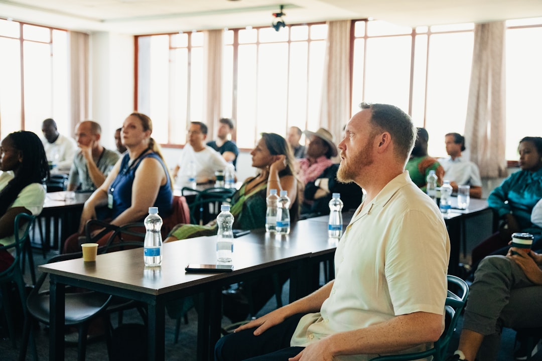 Diverse group of people attending a presentation in-person conference