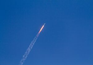flying rocket during daytime