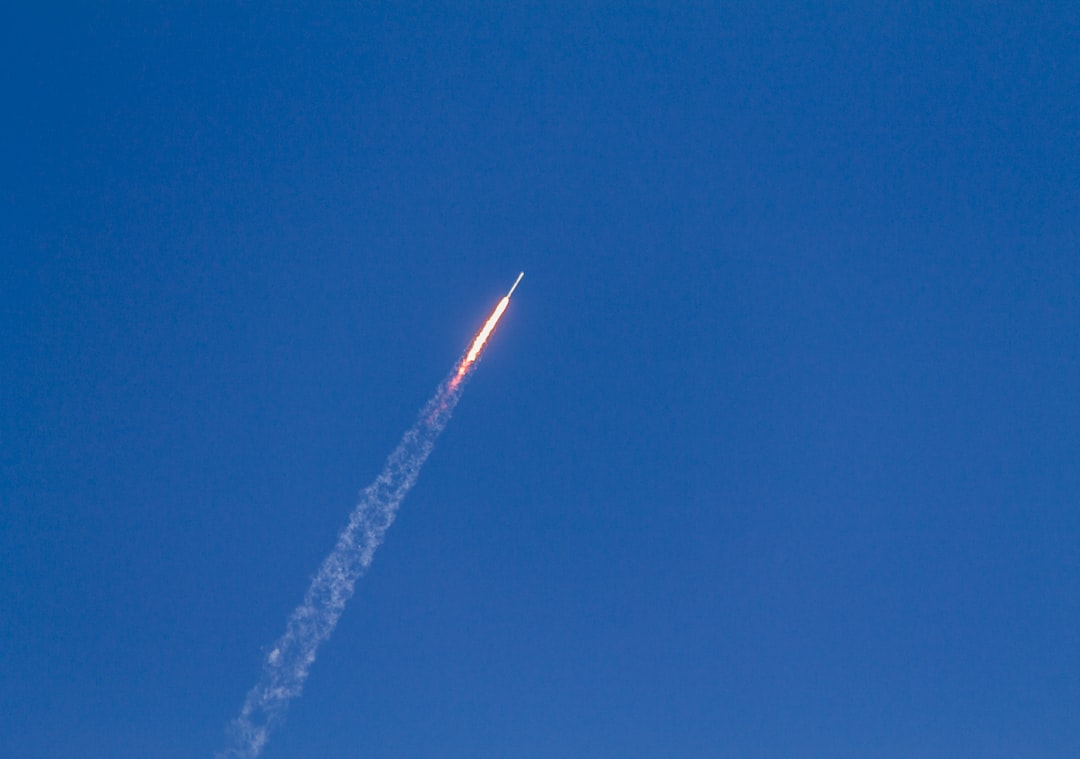 flying rocket during daytime