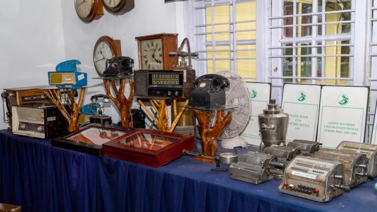 A table topped with lots of different types of clocks