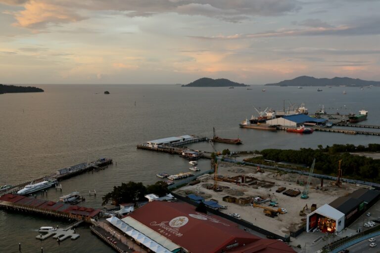 Boats docked in a harbor at dusk