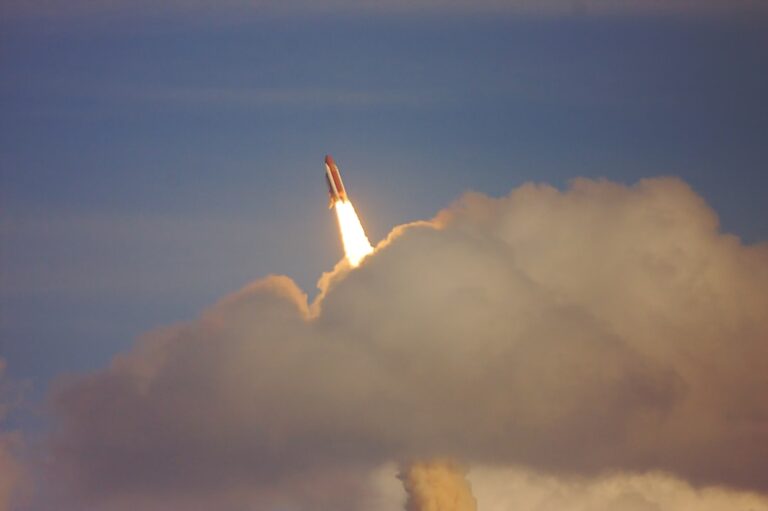 low-angle photography of red space shuttle