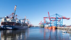 Container ships and cranes at a busy port