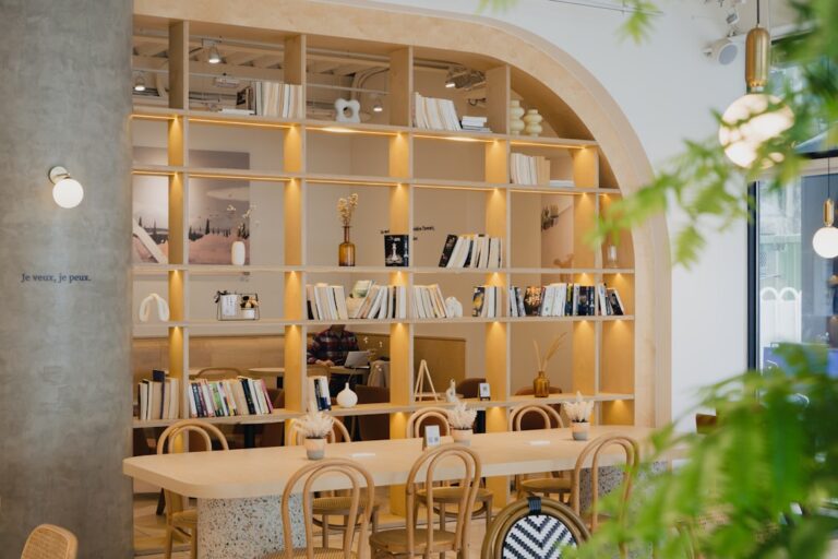 A library-themed cafe with wooden shelves.