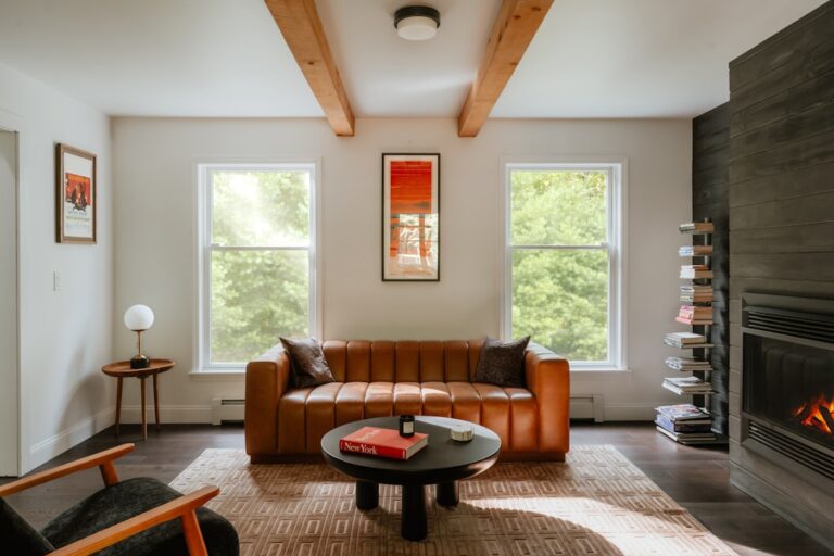Cozy living room with leather sofa and fireplace