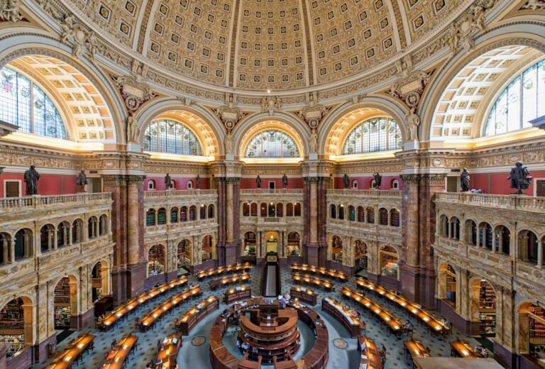 a large ornate building with many arches with Library of Congress in the background