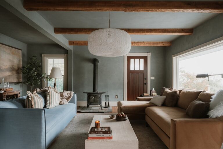 Cozy living room with sectional sofa and wood stove.