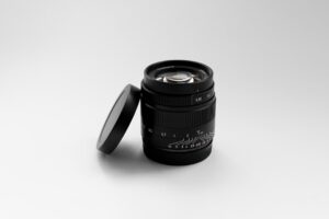 a camera lens sitting on top of a white table