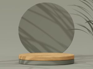a round mirror sitting on top of a wooden stand