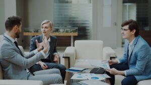 Three business people in a meeting