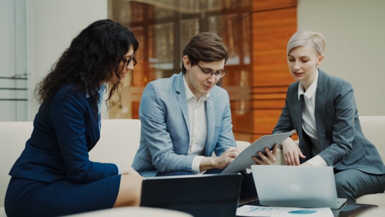 Three business people collaborating on a project