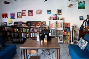 Cozy bookstore interior with bookshelves and seating.