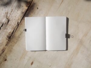 white book on brown wooden table
