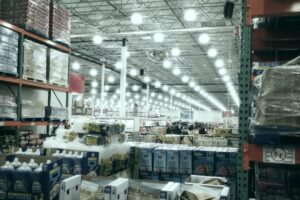 A wide aisle in a brightly lit warehouse store.