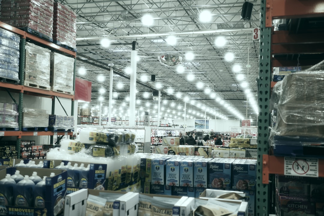 A wide aisle in a brightly lit warehouse store.