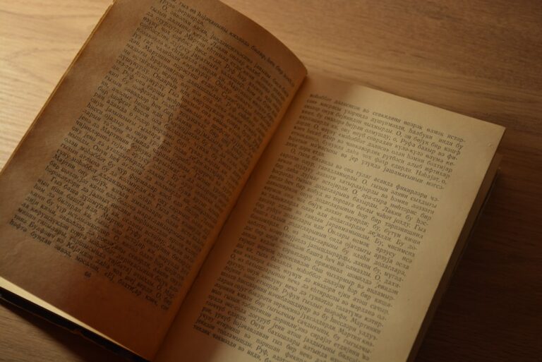 an open book sitting on top of a wooden table