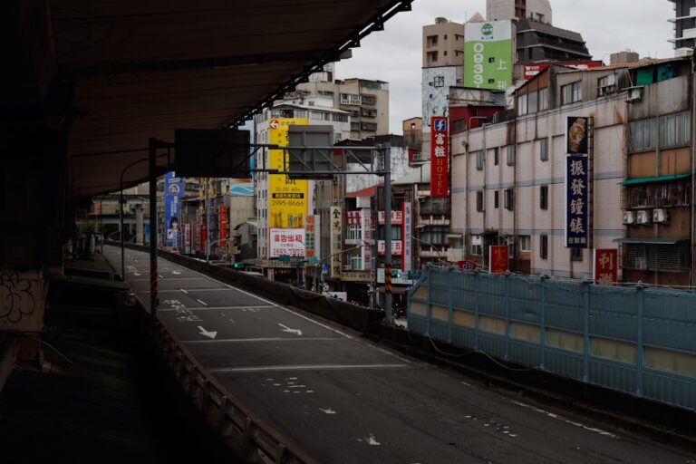 a city street filled with lots of tall buildings
