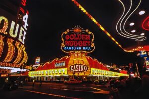 a casino sign lit up at night with neon lights
