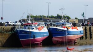 A couple of boats that are sitting in the water