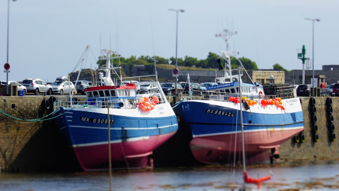 A couple of boats that are sitting in the water