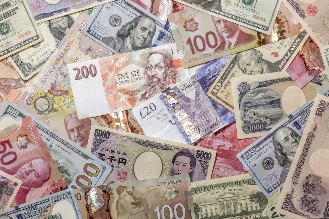 A chaotic pile of various international banknotes.