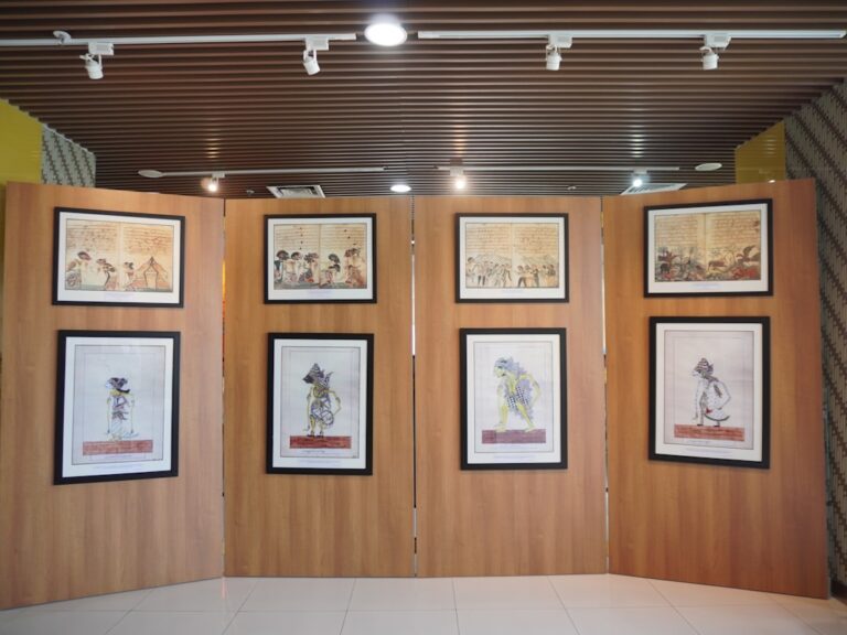 A room with a lot of pictures on the wall