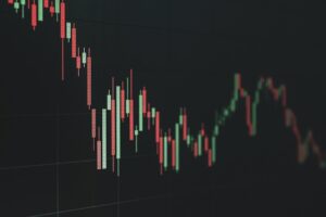 Stock market chart shows a declining trend.