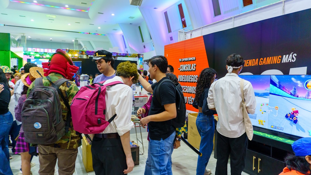 People gathered around a large screen at an event