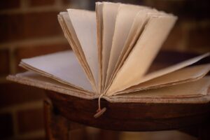 white book on brown wooden table