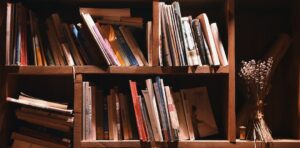 books on brown wooden shelf