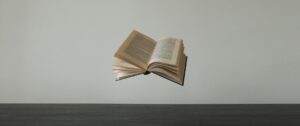 an open book flying through the air