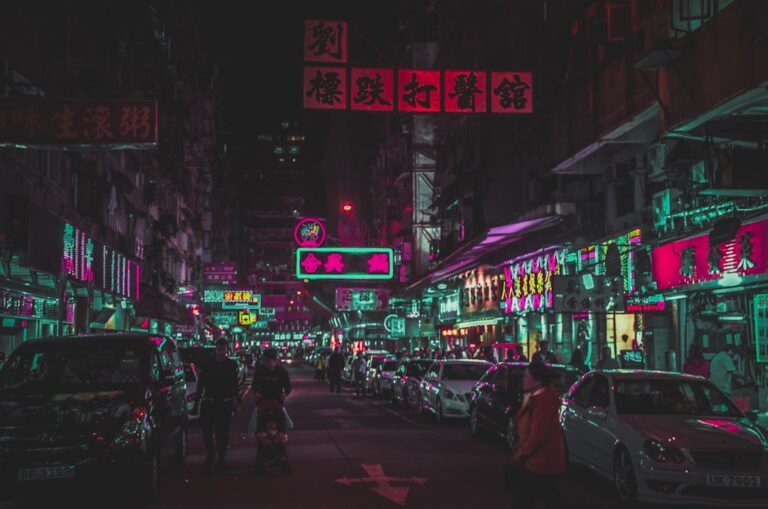 several people walking on street during nighttime