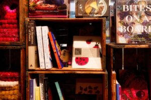 Wooden crates filled with books and decorative items.