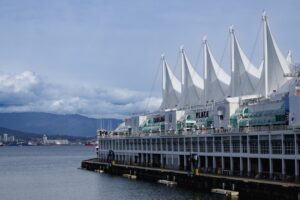 Modern convention center with sail-like roof by water