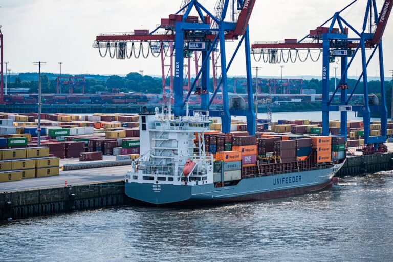 A cargo ship unloads at a busy port.