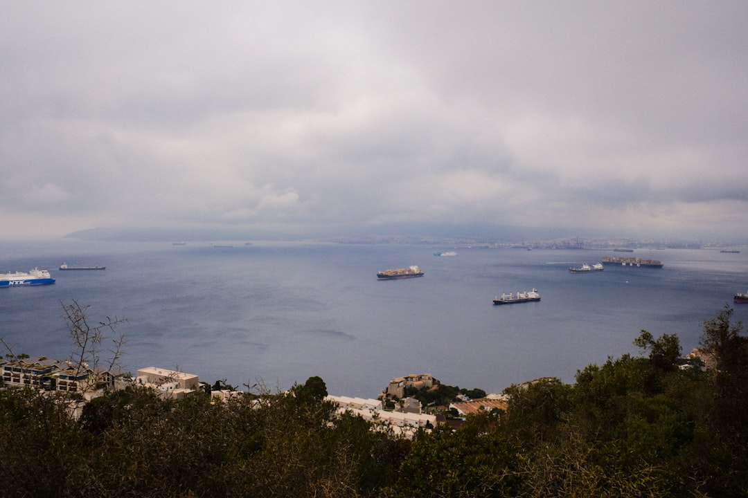 Ships at sea under a cloudy sky